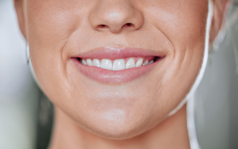 Close-up of a patient with hydrated skin and smile lines.