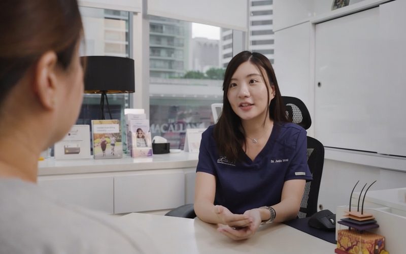 Patient consulting with doctor for clinic assessment of facial volume