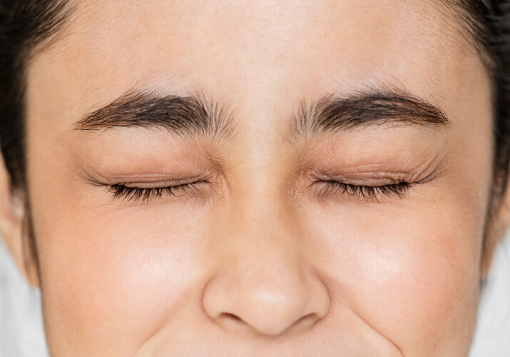 Close-up of eyes showing visible crow's feet fine lines.
